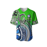 Green baseball jersey with blue tribal wave patterns and Marae Moana Cook Islands crest