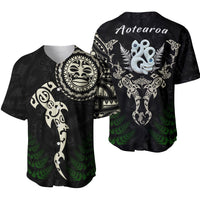 Black baseball jersey, front with circular manaia symbol, green fern and fish print