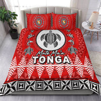 Red bedding set with “Mate Ma’a TONGA” text, circular emblem, black-and-white tribal motifs