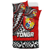 Red Tonga bedding set with two pillowcases, Polynesian crest emblem, black-and-white geometric accents
