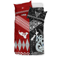 Reversible-style bedding: red Tonga side with white motifs paired with black Aotearoa design