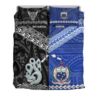 Folded bedding set showing black Aotearoa and blue Samoa panels with crest emblem