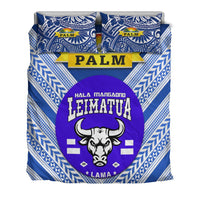 Blue duvet and pillowcases with palm emblem, purple Leimatu'a bull face, geometric trim