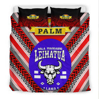 Red, white and black bedding set featuring purple llama-bull oval logo with two black pillows