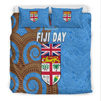 Blue duvet and pillow set with Fiji Day lettering, crest shield, Union Jack, geometric fan patterns
