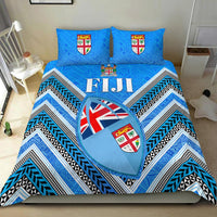Blue Fiji bedding set with chevron stripes, shield emblems, and heart graphic on duvet