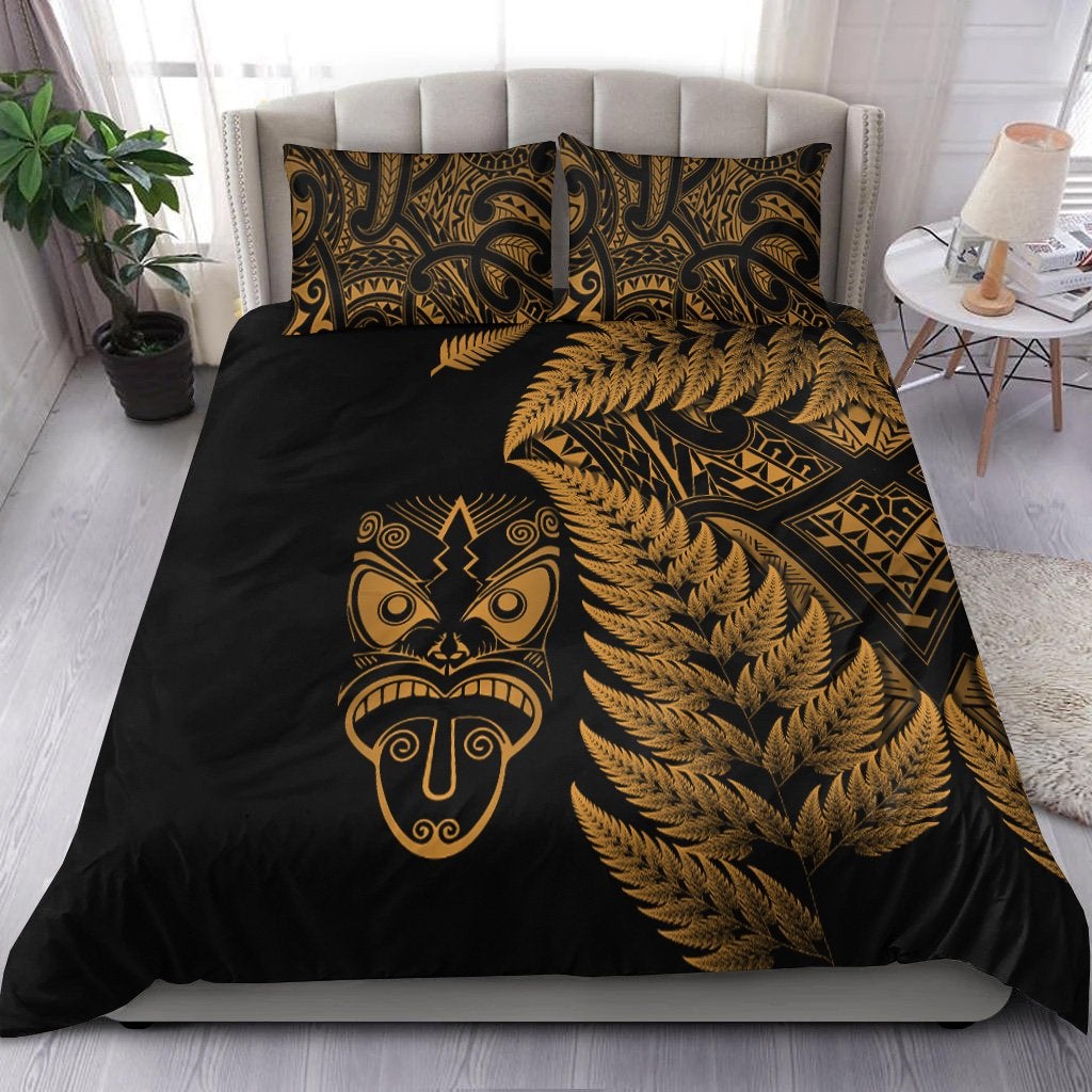 Black duvet set with gold Maori mask, fern fronds, and geometric patterns; 2 matching pillowcases