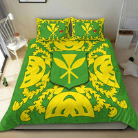 Green duvet and two yellow pillowcases with matching shield crest and vine pattern