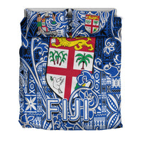 Blue/white tapa bedding set with central Fiji flag cross and large “FJ” letter print