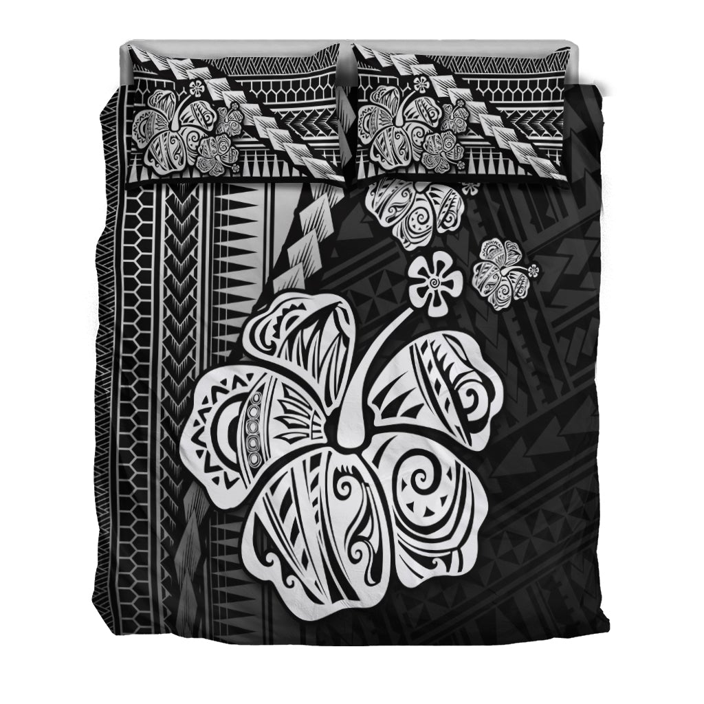 Black bedding set featuring hibiscus, turtle, and geometric tribal patterns with pillowcases