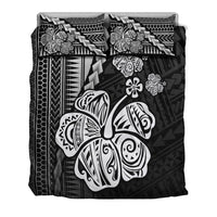 Black bedding set featuring hibiscus, turtle, and geometric tribal patterns with pillowcases