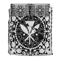 Flat lay black-and-white bedding set: hibiscus medallion, birds, ornate frame, with 2 pillows