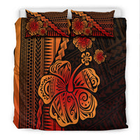 Black bedding set featuring large turtle artwork, red-orange hibiscus accents, and matching pillows