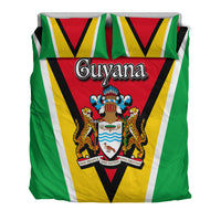 Guyana flag comforter with central crest and bold green, yellow, and white striped design