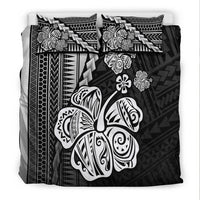 Black bedding set with hibiscus, sea turtle prints, and geometric tribal border
