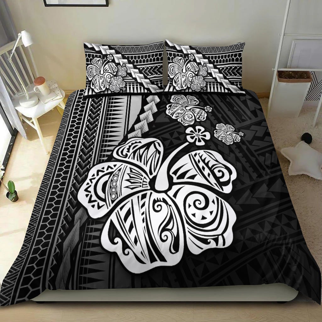 Black duvet with hibiscus and tribal sea turtle motifs; matching pillowcases