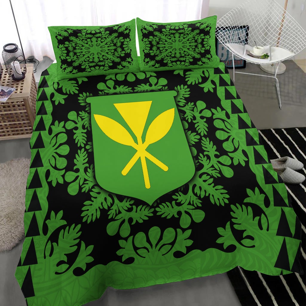 Green & black bed set with leaf print comforter, shield emblem, and two green pillows