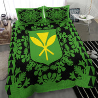 Green & black bed set with leaf print comforter, shield emblem, and two green pillows