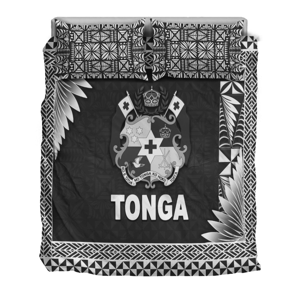 Tonga bedding set close-up: black panel with crest and TONGA, tribal geometric edges