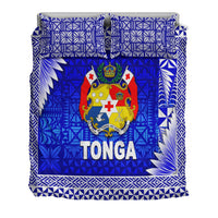 Blue Tonga duvet and pillows with coat of arms crest, TONGA word, and border patterns