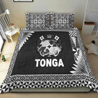 Black Tonga bedding set with matching pillows, coat of arms crest, and TONGA text