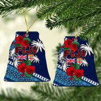 Blue triangular Christmas tree ceramic ornament with Fiji lettering, flags, hibiscus and palms.