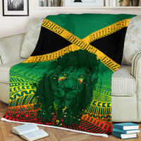 Rasta kente style blanket with green lion face, red-yellow patterns and black accents