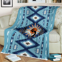 Turquoise Southwestern blanket with zigzag diamond pattern and orange Kokopelli motif