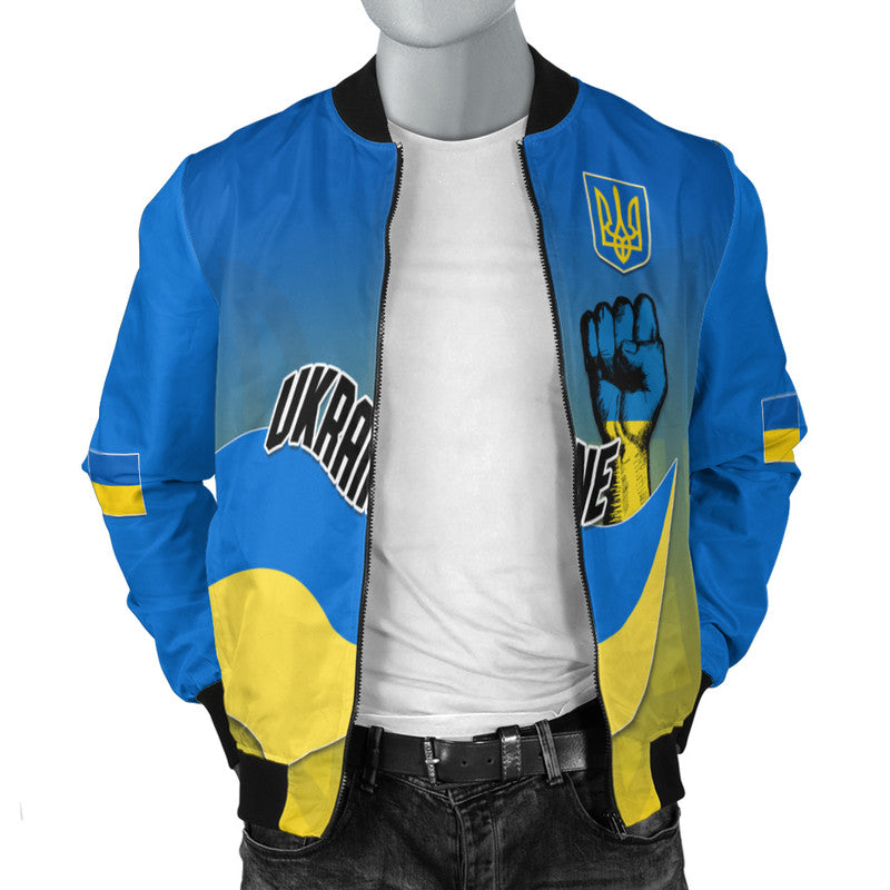 Blue bomber jacket front with trident patch, fist graphic, and yellow lower panel