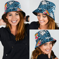 Blue bucket hat with tropical hibiscus and palm leaf print, brim and crown visible