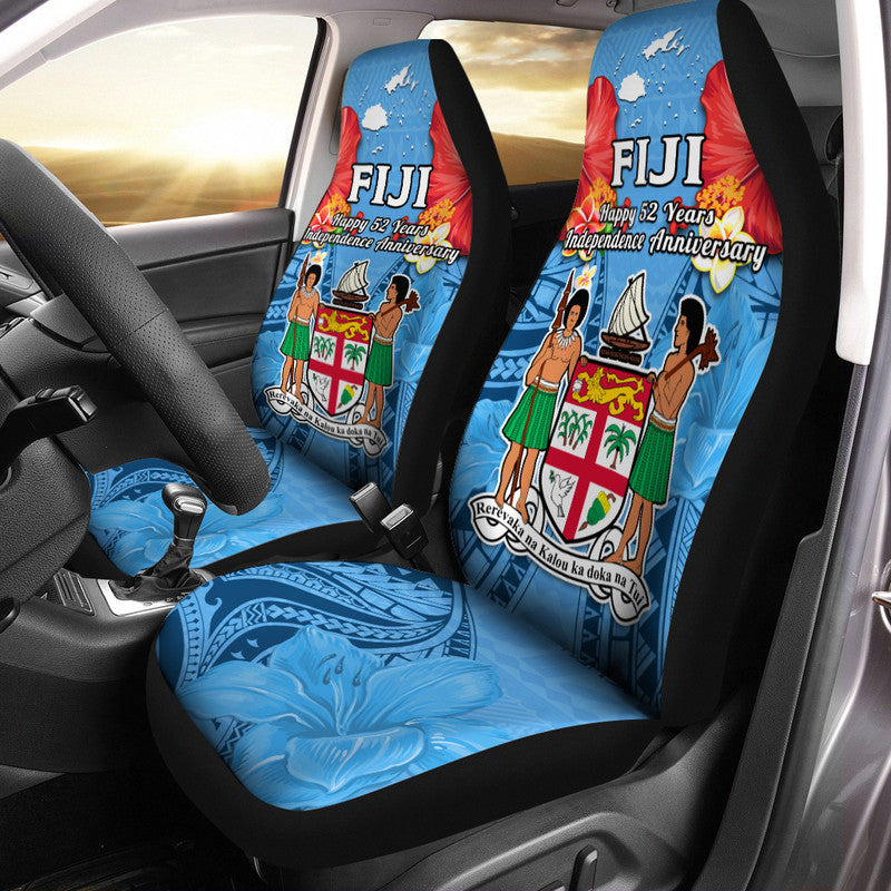 Installed blue car seat covers in vehicle, FIJI “Happy 52 Years Independence Anniversary” print
