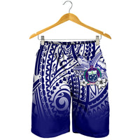 Blue and white men's swim shorts on hanger, elastic waistband, tribal turtle print