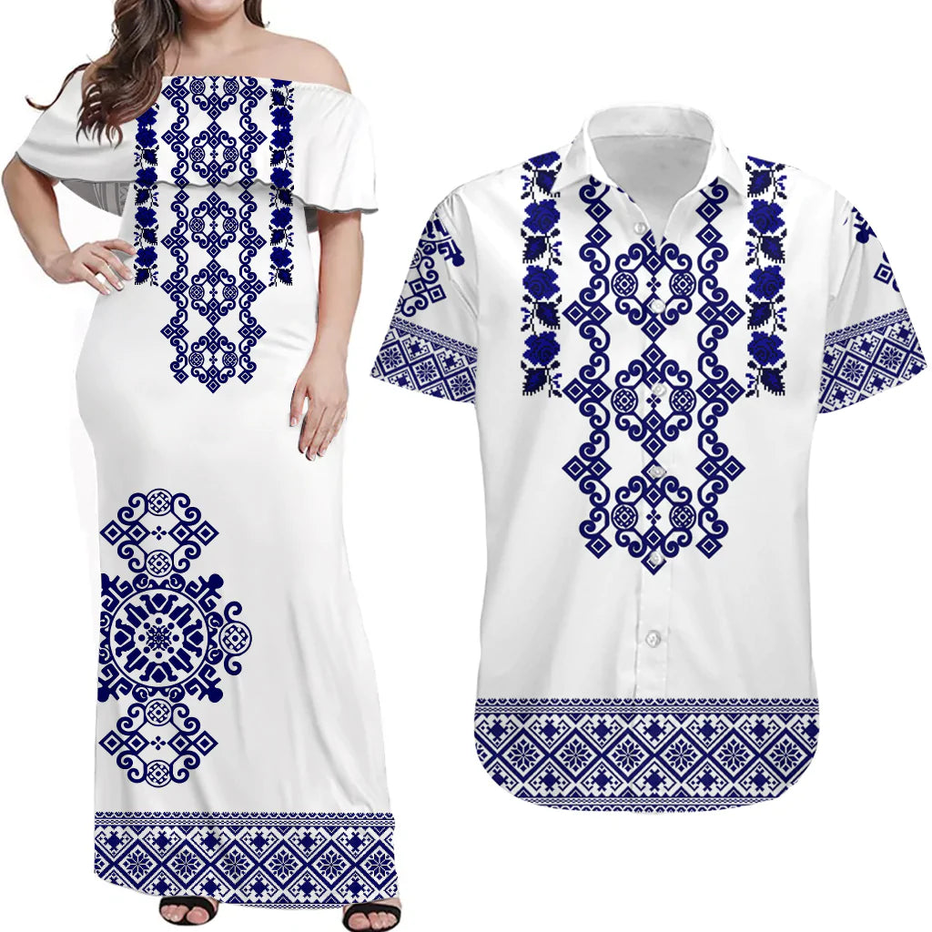 White off-shoulder maxi dress with blue folk embroidery and patterned hem