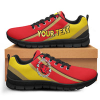 Red and yellow custom sneakers with black sole, lace-up, bold 'YOUR TEXT' print