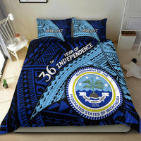 Blue bedding set featuring crest logo, bold geometric print, and two pillow shams