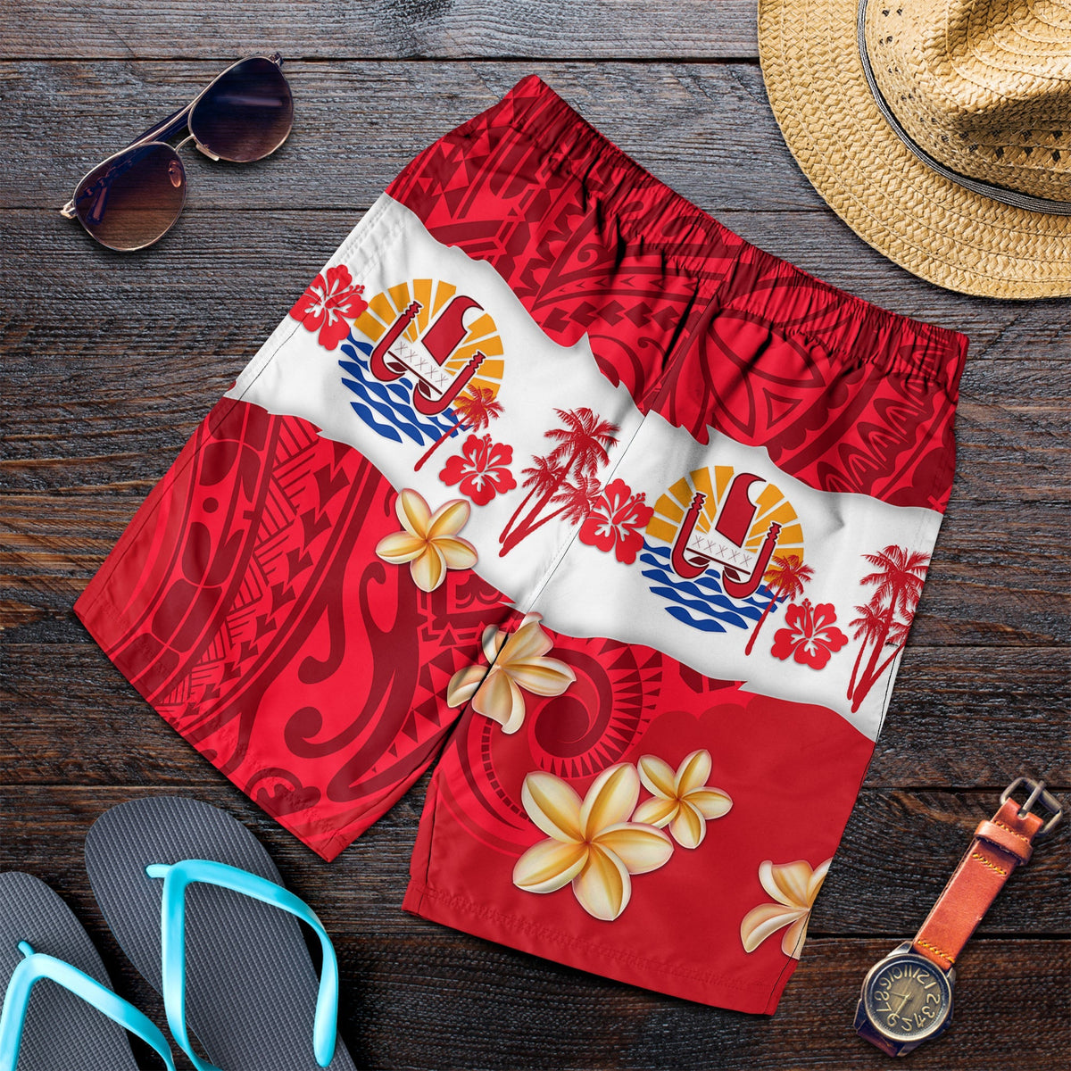 Red tropical swim shorts with white island floral scenes and elastic waist