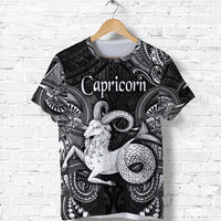 Black Capricorn zodiac T-shirt with Polynesian-style ram and flower pattern, graphic front