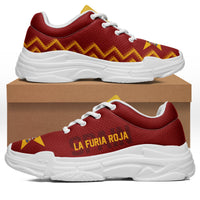 Red chunky sneakers with white sole, zigzag yellow pattern, white laces, “LA FURIA ROJA”