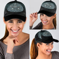 Black classic cap with gray-blue Odin emblem and curved brim, on smiling wearer