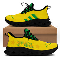 Canarinho clunky sneakers with yellow knit upper, green stripes, and black chunky sole