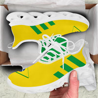Canarinho clunky sneakers with yellow knit upper, green stripes, white laces, and white sole