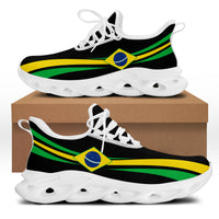 Chunky sneakers, black upper with Brazil stripe badge, white laces, thick white sole