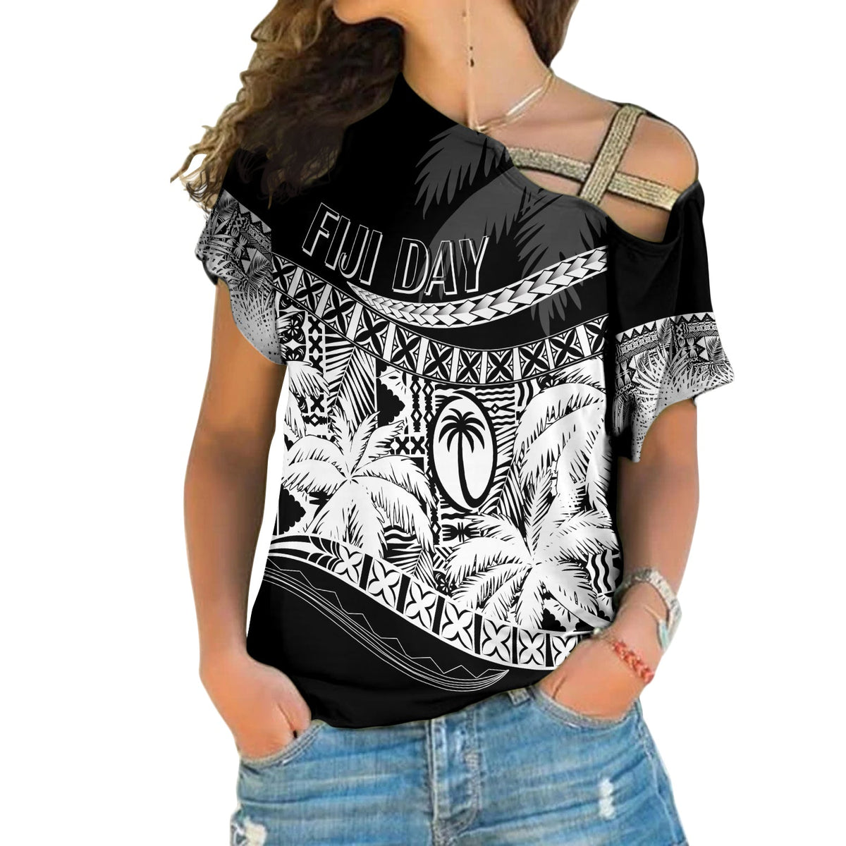 Black off-shoulder T-shirt with white tropical print and "FIJI DAY" graphic across chest