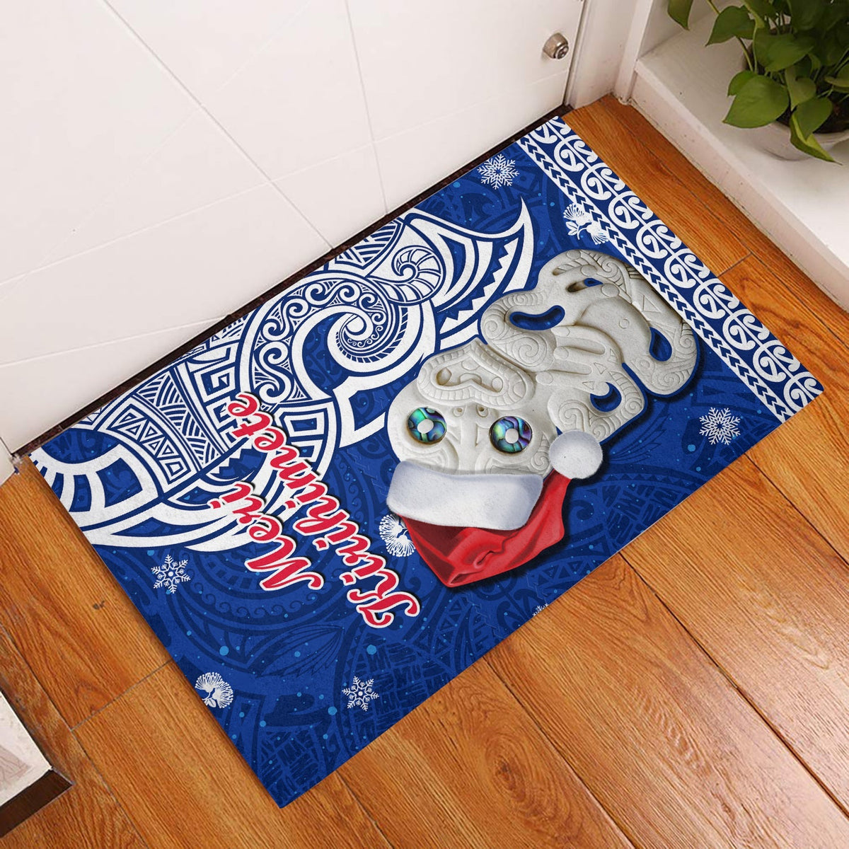Blue New Zealand Christmas door mat with white hei tiki and red script
