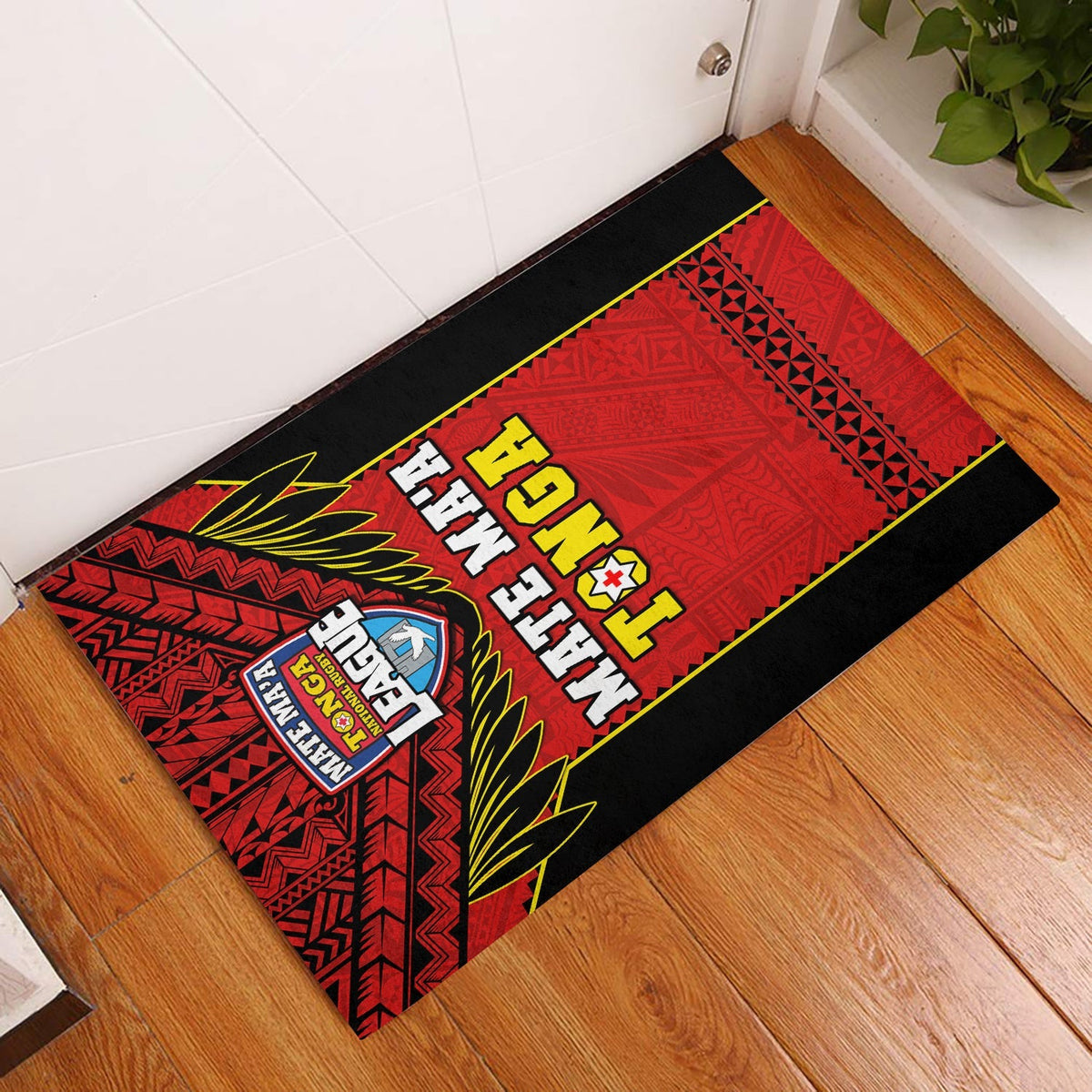 Black-bordered red Tonga rugby door mat with patterned design and bold lettering