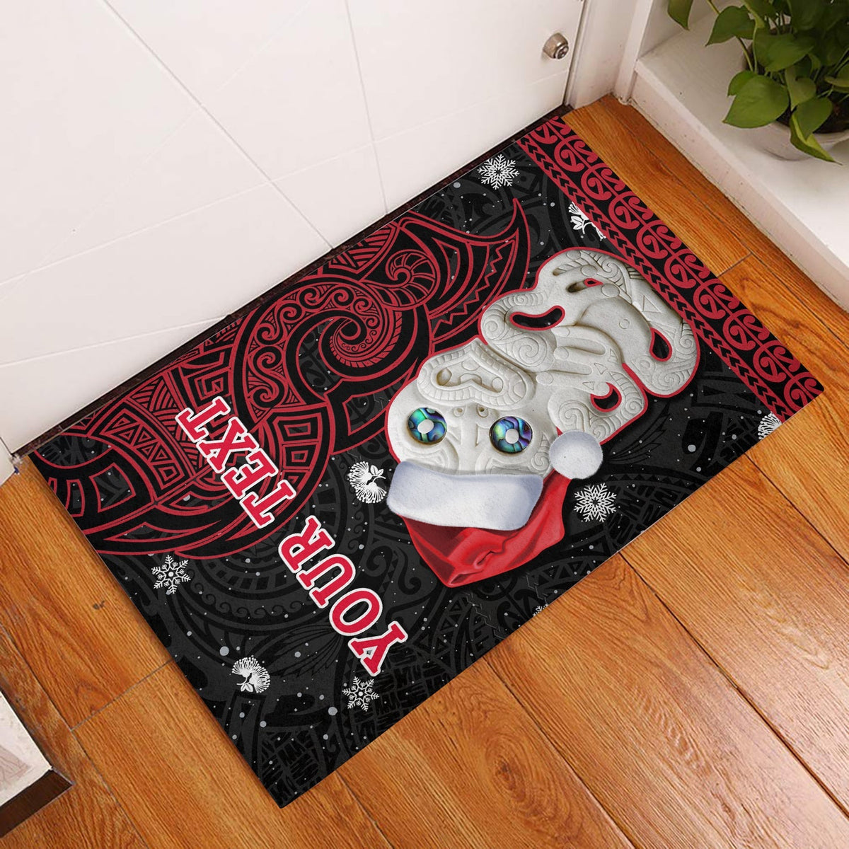 Red and black Christmas door mat with Hei Tiki and decorative patterns