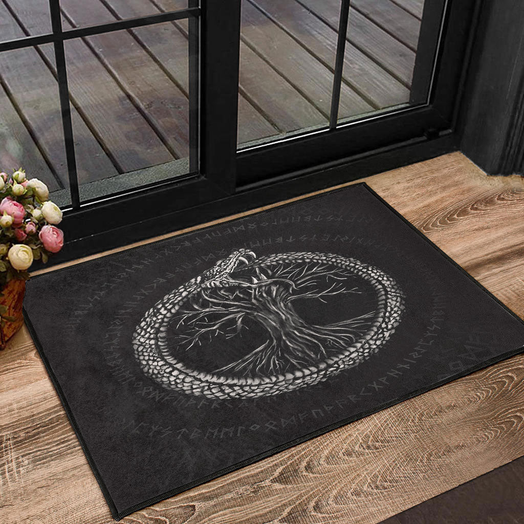 Black door mat with white ouroboros and tree of life emblem, rectangular