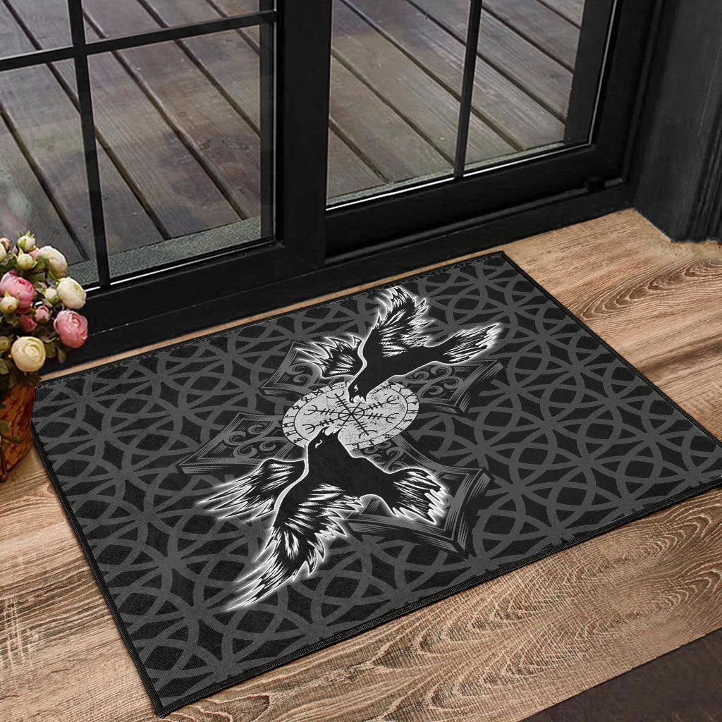 Black doormat with Viking raven and compass cross graphic on dark geometric pattern