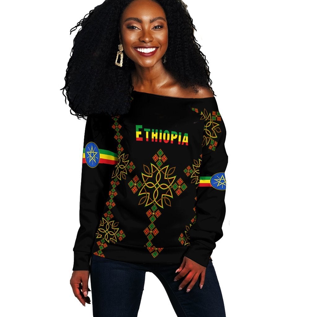 Women’s off-shoulder sweater, black with Ethiopia text, map, and colorful pattern