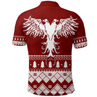 Red polo shirt back with large white eagle wings graphic and Christmas border patterns